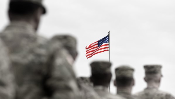 United States military veterans in front of the American flag