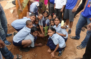Children planting trees in India Children planting trees in India