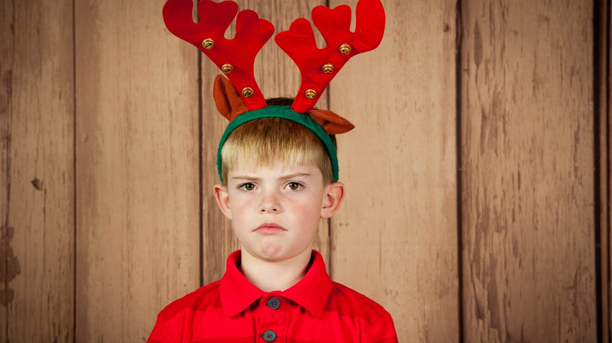 Unhappy Child From Parent Posting During The Holidays