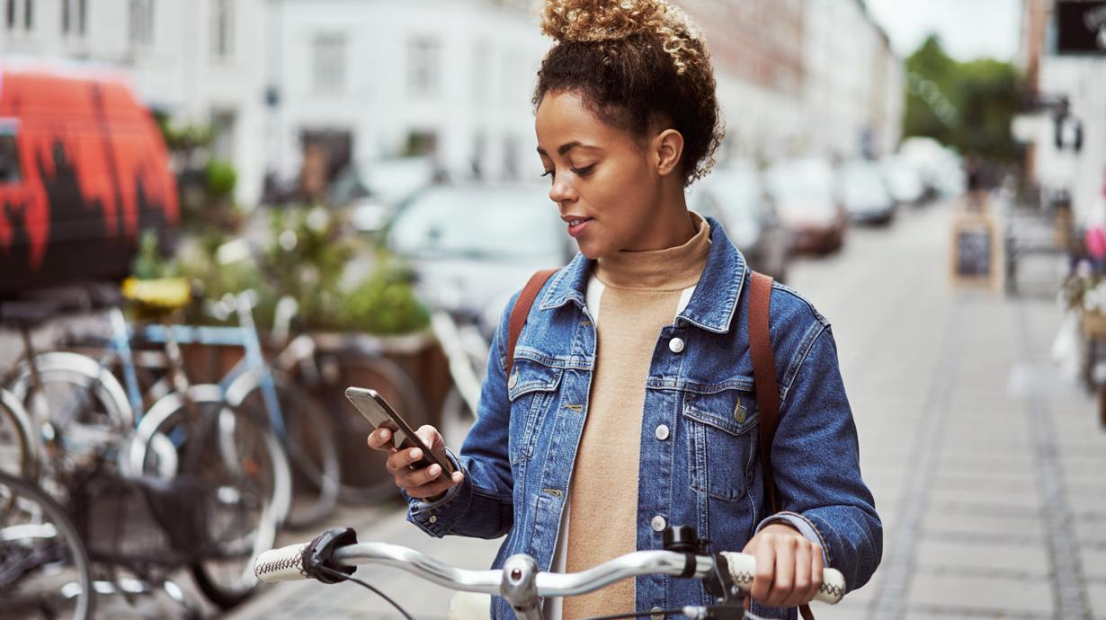 Woman On Bike Using The Most Reliable 5G Network