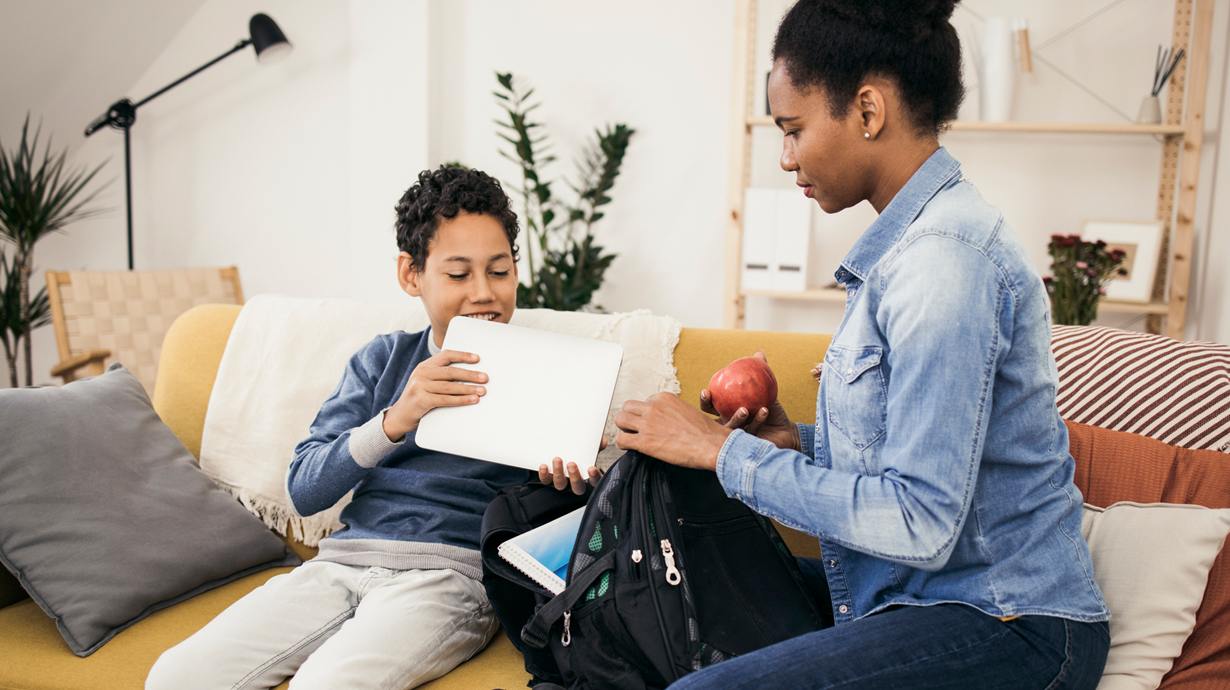 Mother Helping Son Pack For School | Back To School Tech