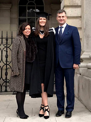 Ronan poses with his daughter, Charlotte for her graduation