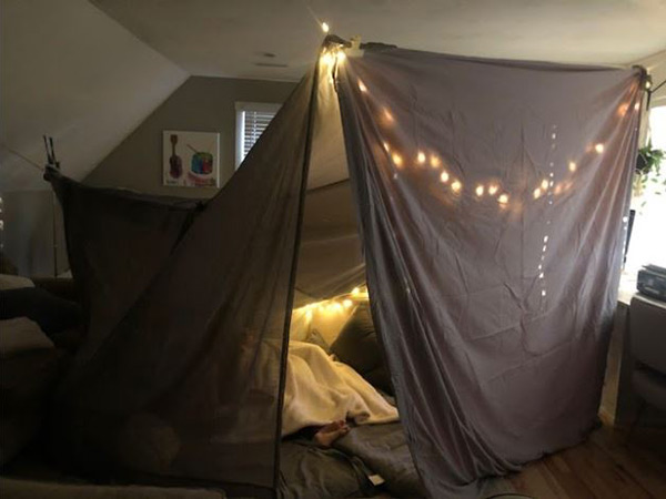 Somewhere inside this impressive blanket tent, Crystal Wood’s girls are making sure they’re not missing their favorite TV shows.