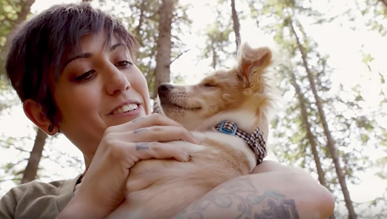 Woman holding dog