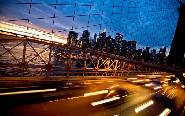 Traffic zooming along the Brooklyn Bridge in lower Manhattan