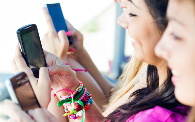 Teen girls on smartphones