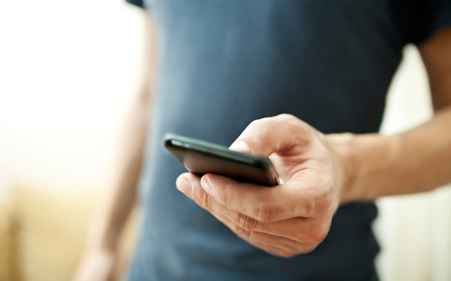 Close up of man using a smartphone