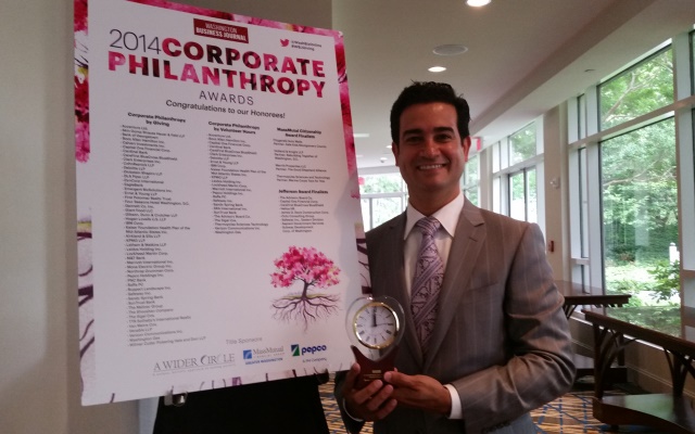 Verizon's Mario Acosta-Velez receiving the 2014 Corporate Philanthropy Award