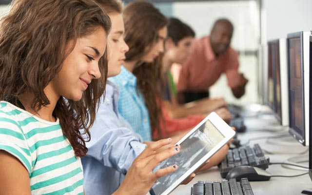 Teen student on tablet