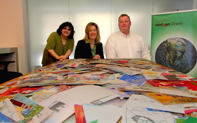Verizon Green team members Barbera Frances, Deb Shugard and Wilmer Johnson help collect used greeting cards.