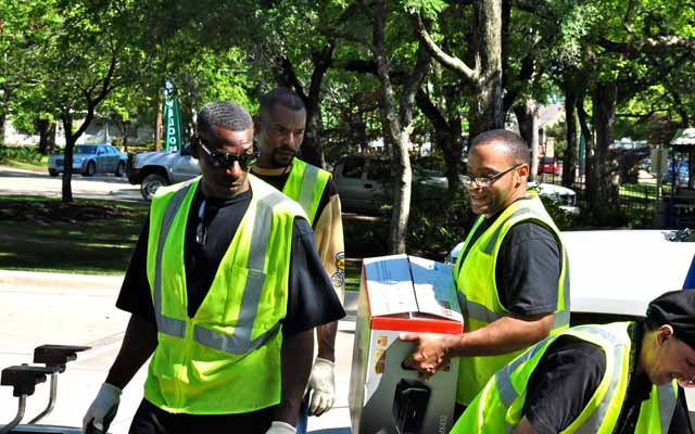 Volunteers disposing of old electronics