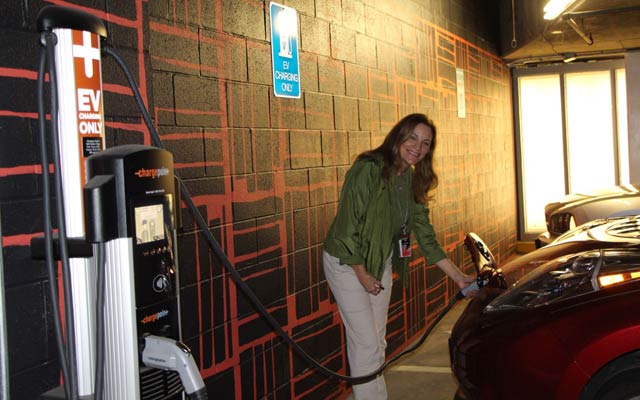 Verizon Green Team member Maggie Sullivan, charging her 2015 Nissan Leaf (affectionately named Lucy) while visiting the Verizon Green Expo in Irving, Texas on Earth Day.