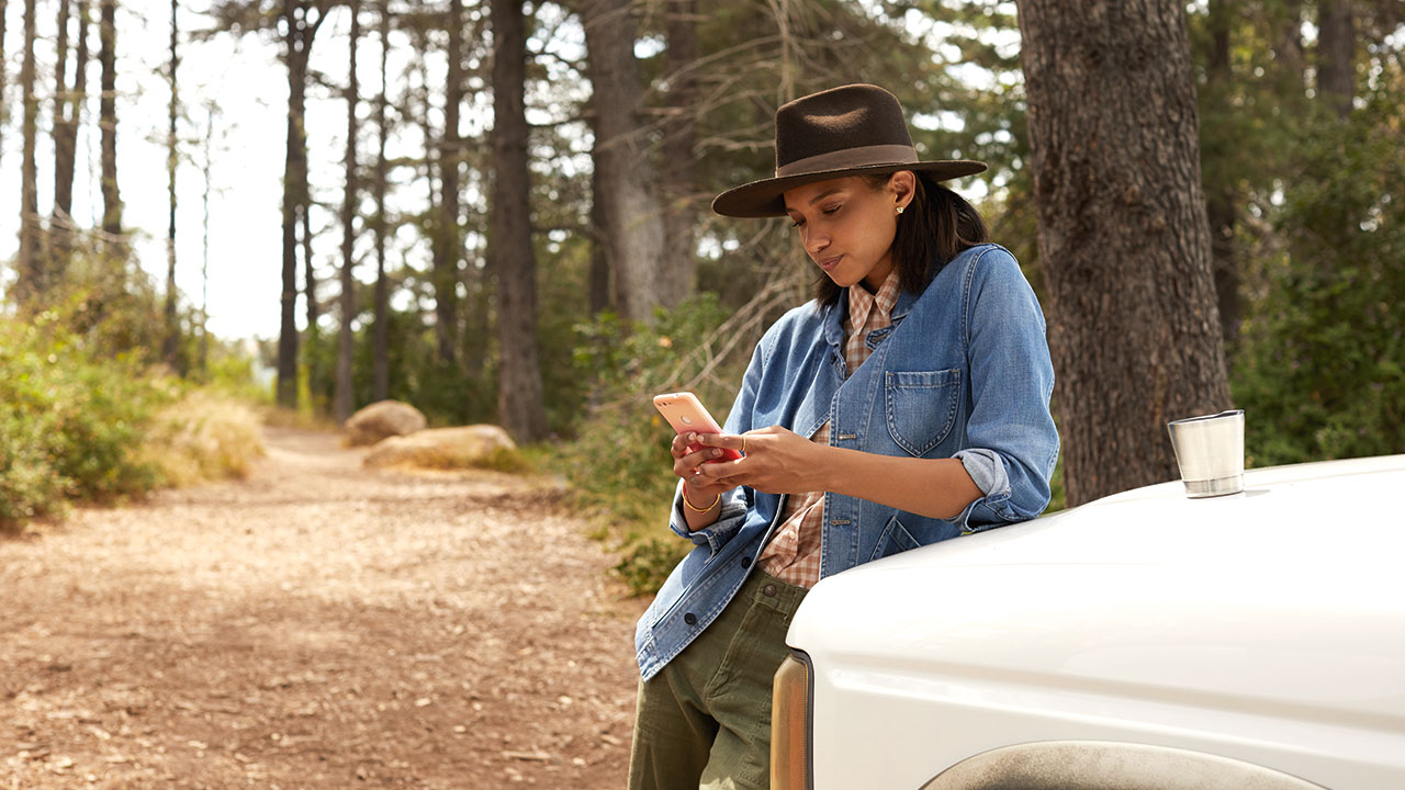 Woman on phone in woods