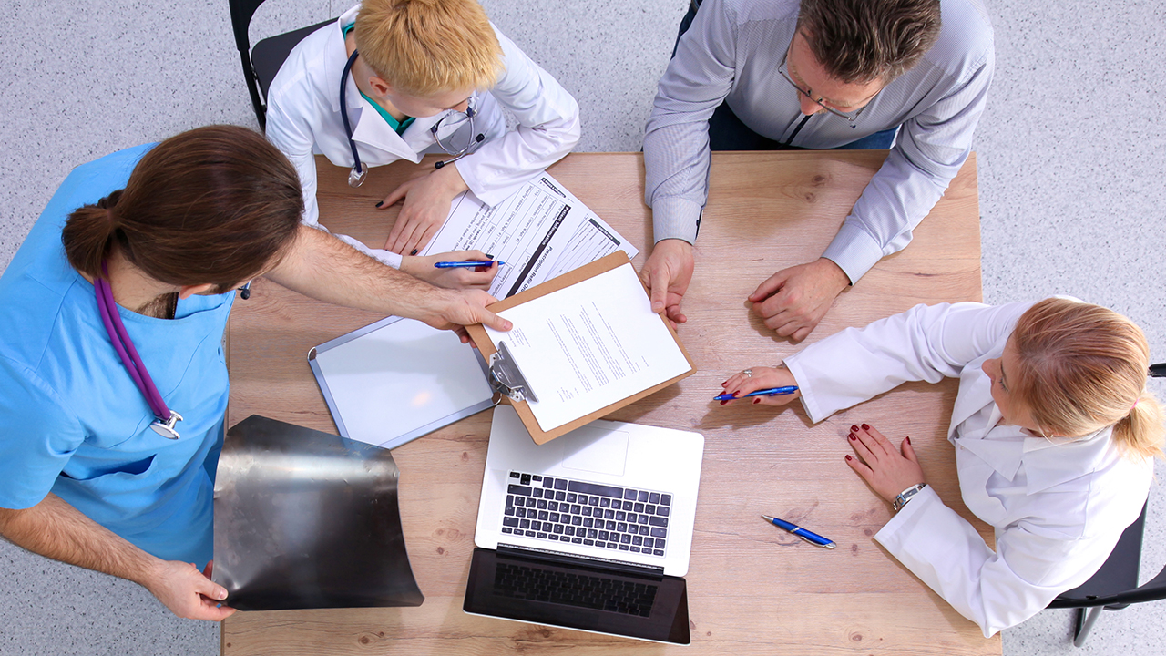 Medical professionals at table