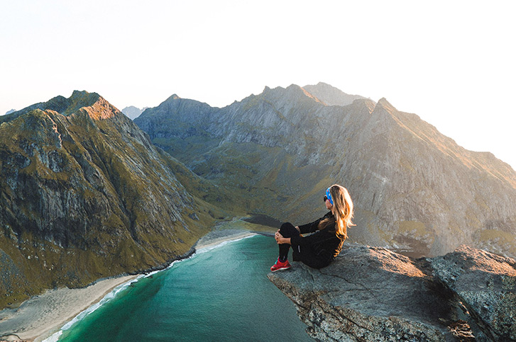 woman on top of a mountain 