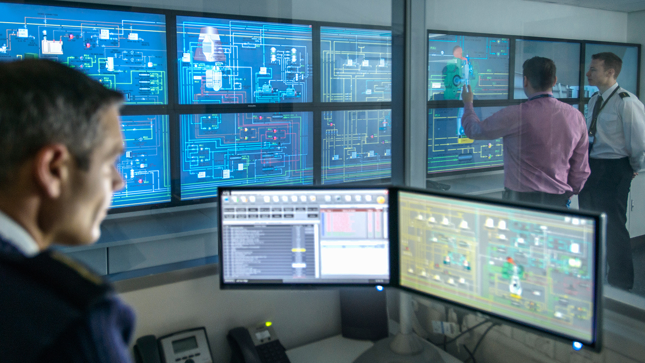 Man in front of computer screens