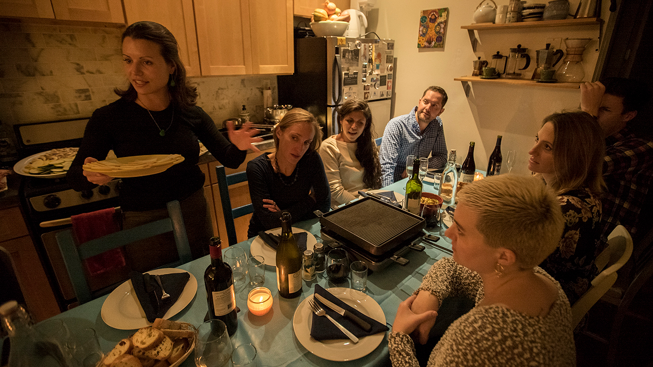 People eating at kitchen table