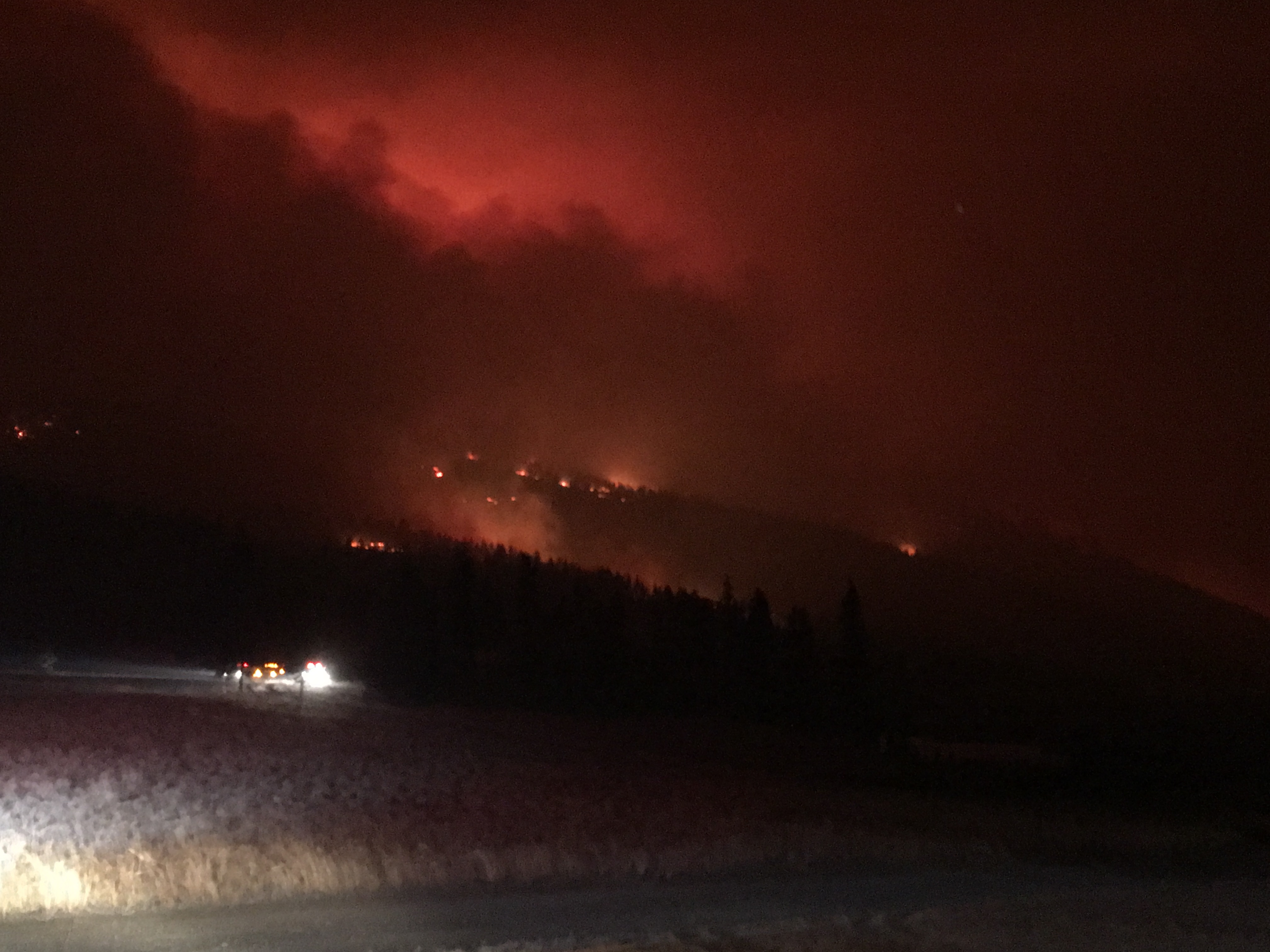 One of Bryan’s pictures of a wildfire scorching the hills of Montana at night.