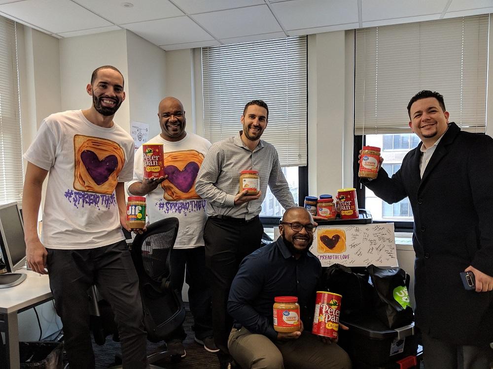 Charlotte and NYC teams pose with their PBJ sandwiches