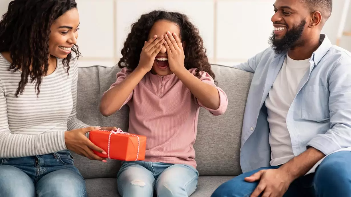 Parents Giving Holiday Gift To Daughter | Tech Gifts For Kids