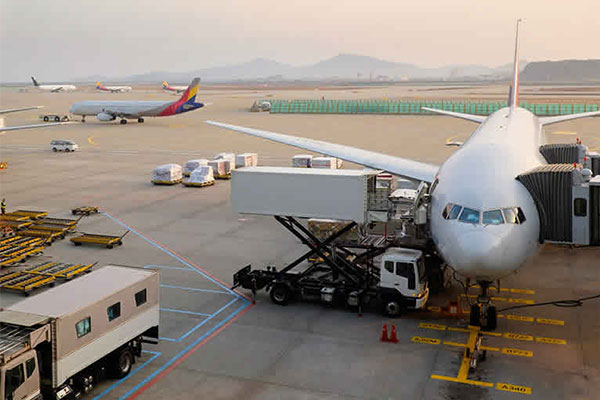 Passenger airplane parked on the tarmac at an airport.