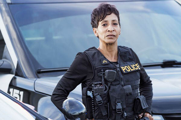 Police officer by vehicle