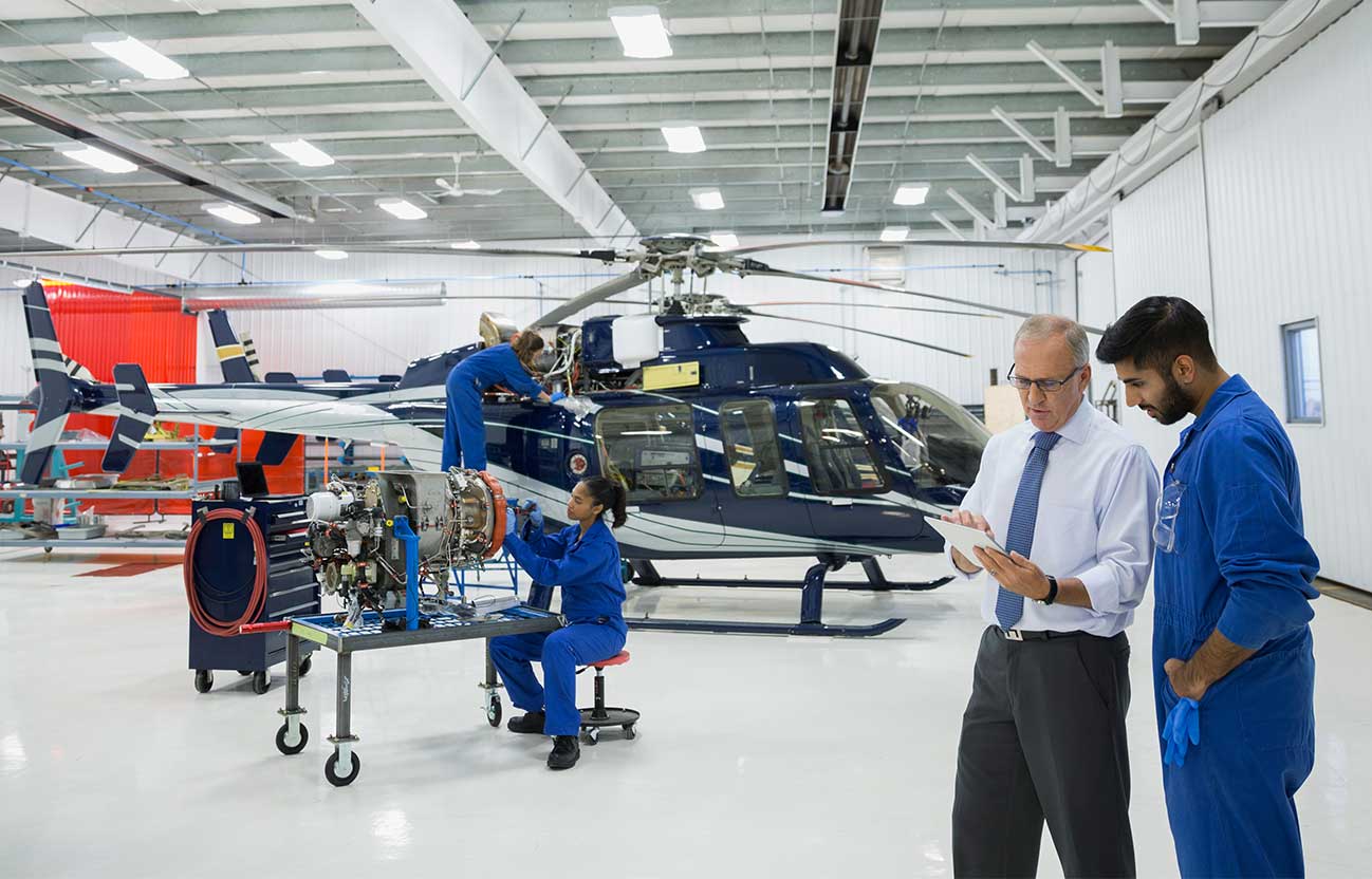 Aviation team working on helicopter