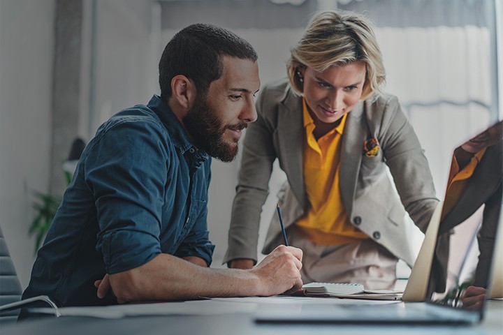Business colleagues working together on a project in meeting room