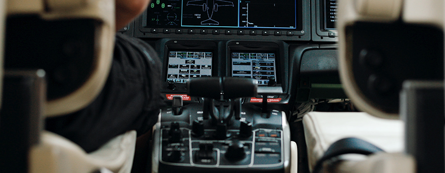 Airplane flightdeck controls inside of an airplane cockpit