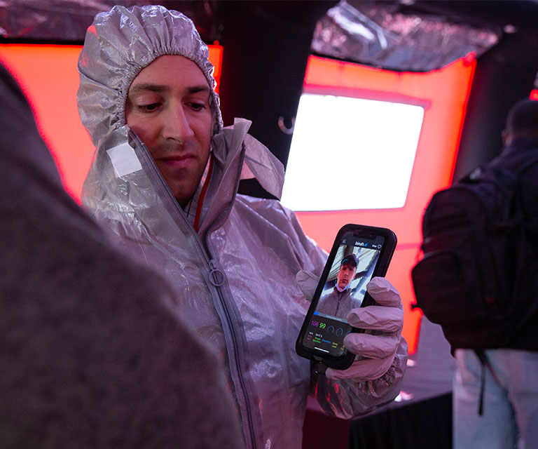 Medical worker holding mobile device