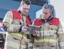 Two Firemen Looking at Tablet
