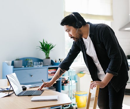 Asian man talking over the laptop