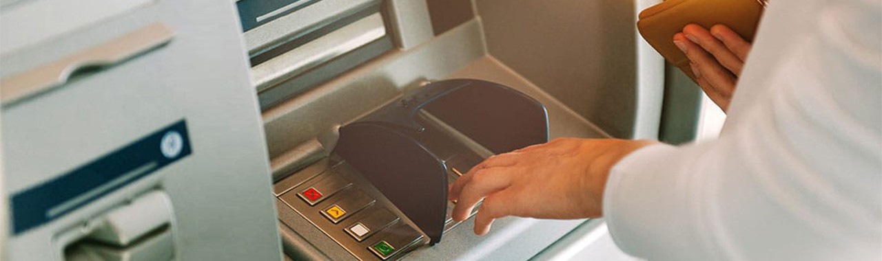 bank customer withdrawing money from atm machine