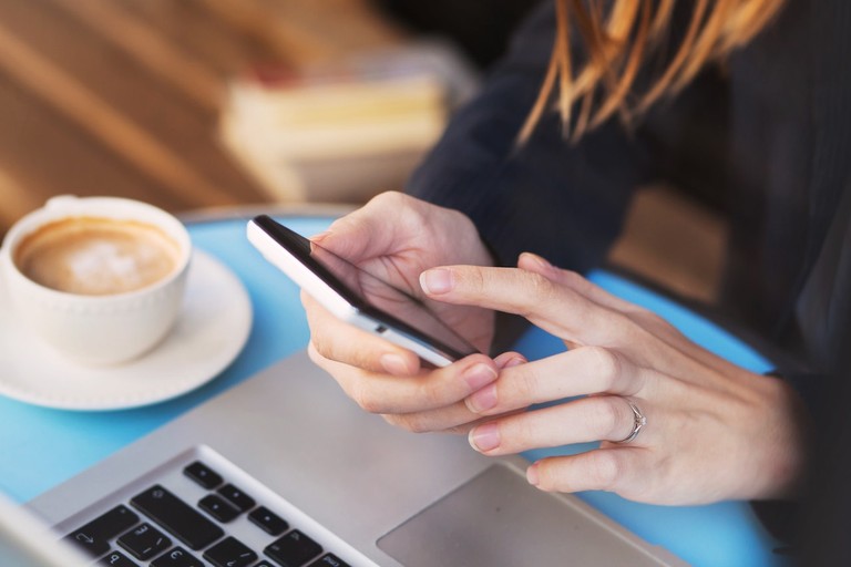 mobile internet, wifi connection on smartphone in cafe