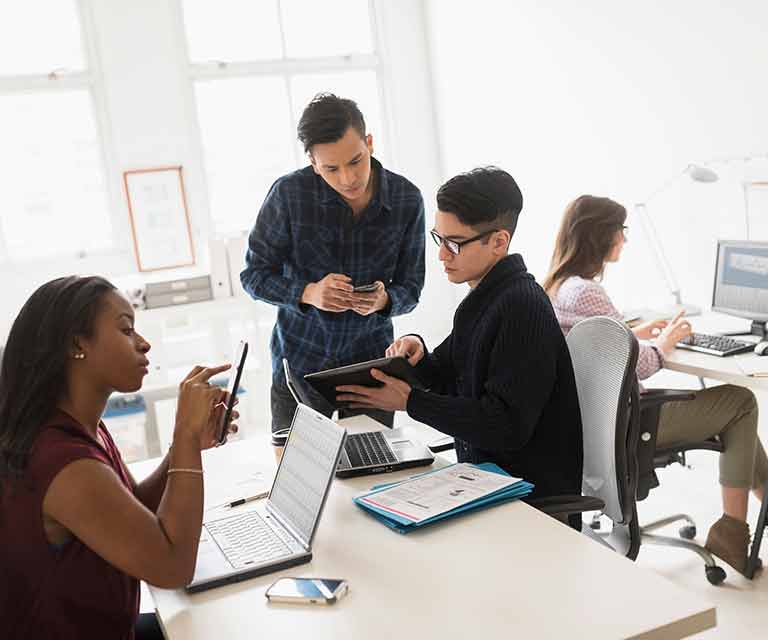 People collaborating in office setting