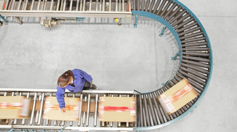 woman in warehouse checking packages