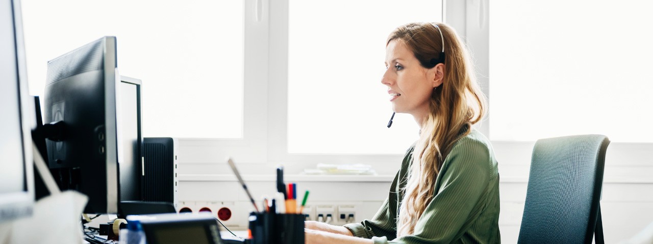 woman on computer phone helping customer