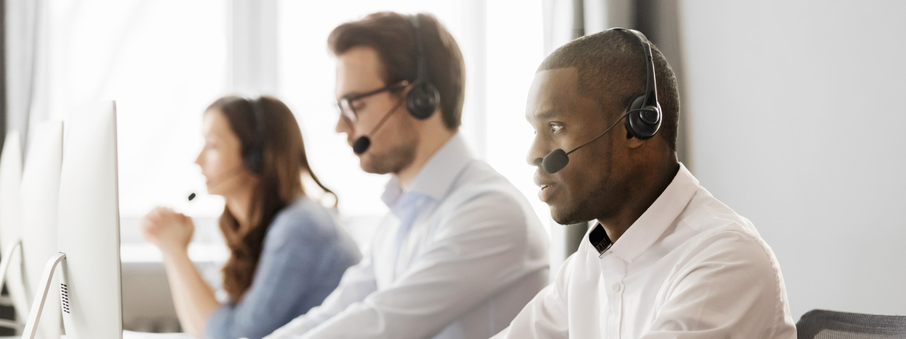 call center workers help customers