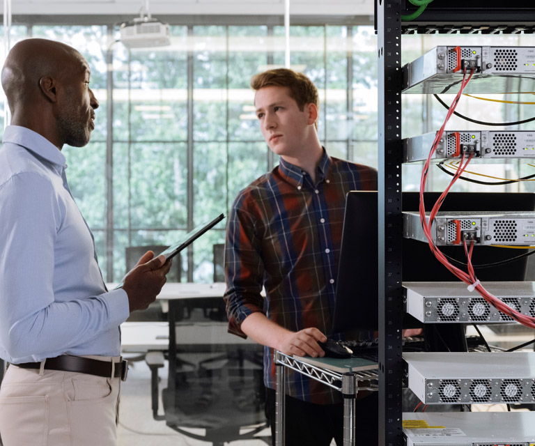 two employees discussing data server