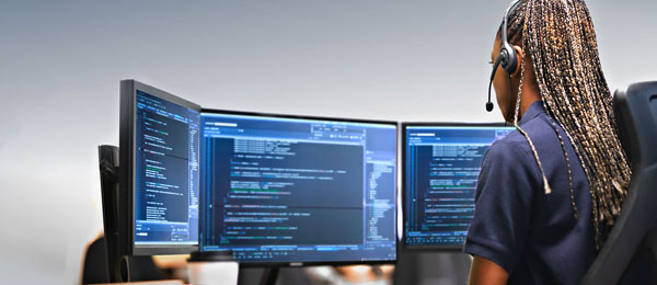 new security pages woman looking at monitor