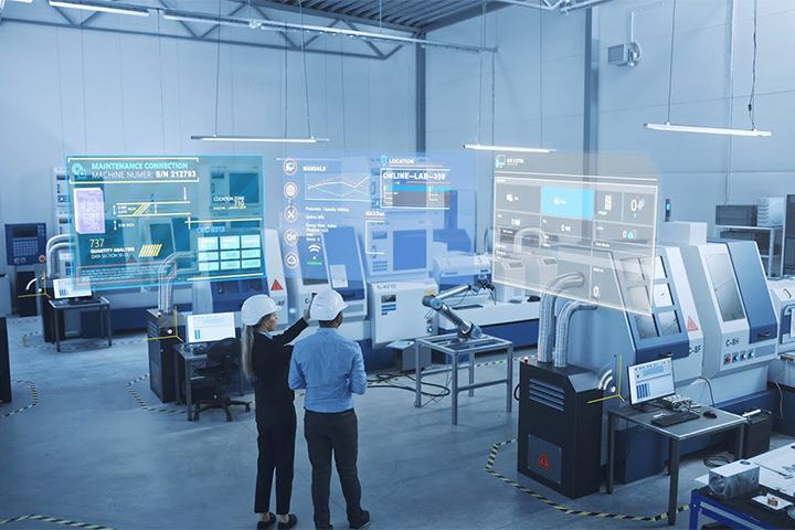 Two engineers utilizing futuristic technology in a workshop