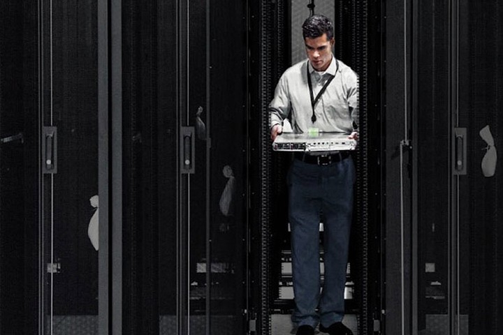 Man in server room.