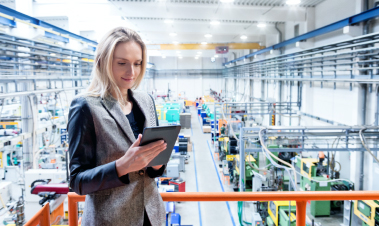 woman looking at tablet in warehouse