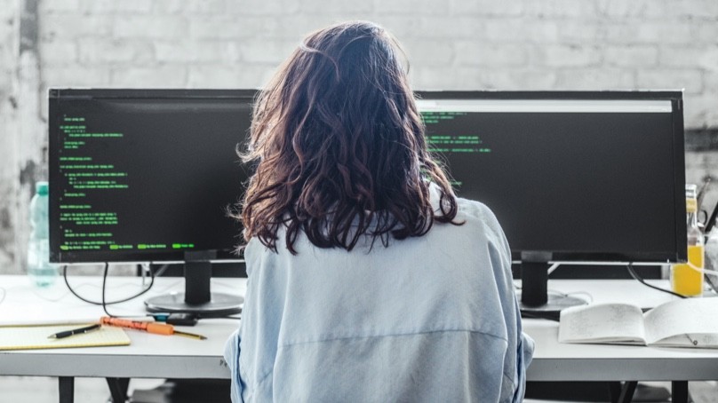 woman looking at computer monitor