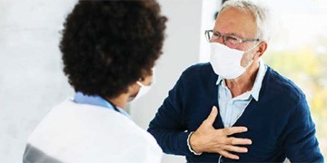 healthcare provider speaks with a patient