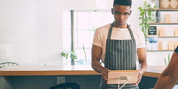 Restaurant worker with tablet