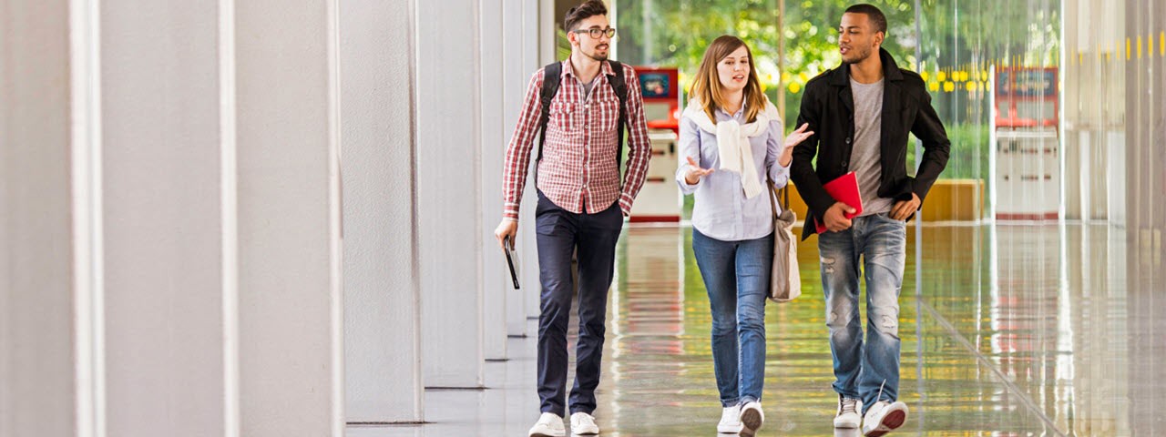 College students walking in campus building