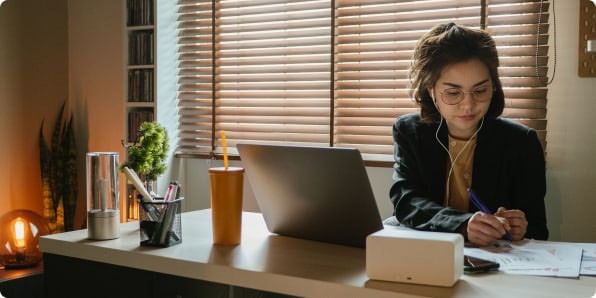 Woman at desk with laptop