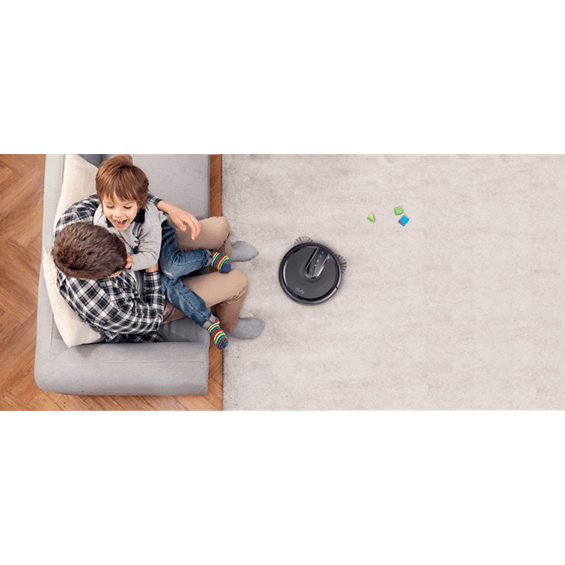 View of man and boy watching Anker Eufy RoboVac 35C