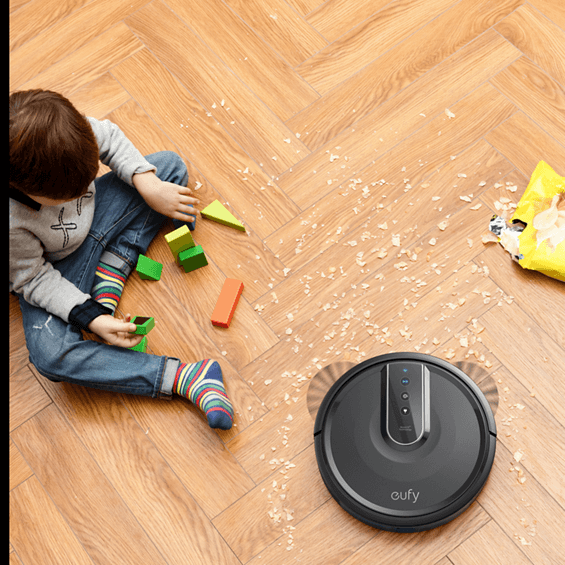 View of child watching Anker Eufy RoboVac 35C